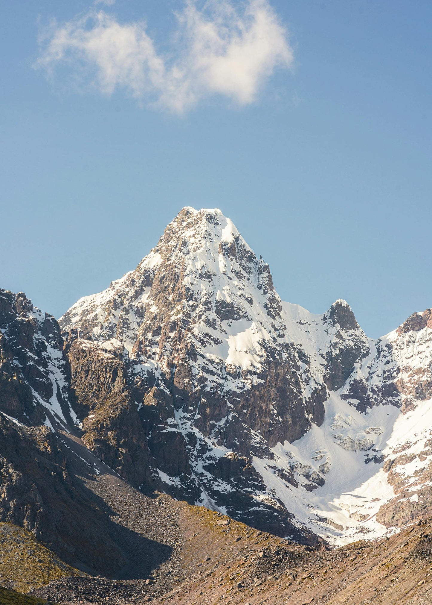 Snow-capped mountain peak with a clear blue sky