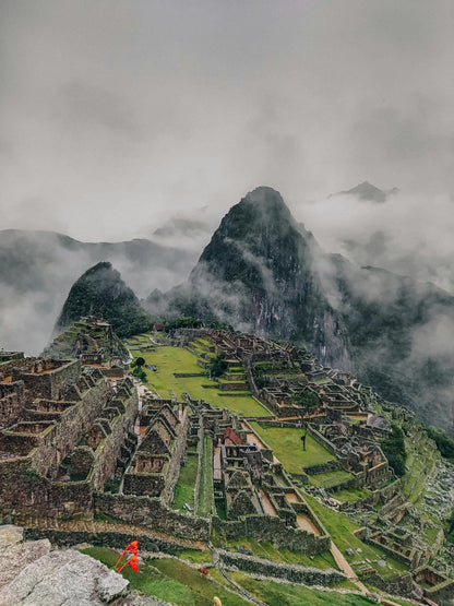 Machu Picchu with misty mountains in the background